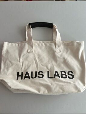 HAUS LABS Canvas Tote Bag in Cream with Black Logo lady Gaga